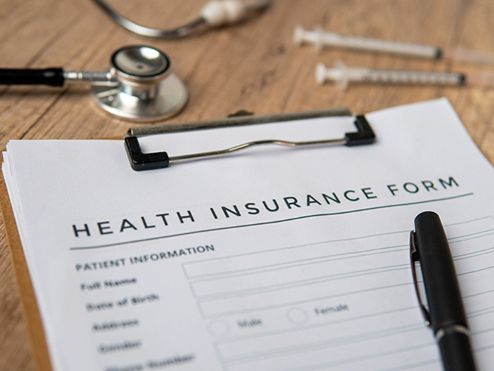 Home 5 a close up image of health insurance form on a cli 2025 03 14 19 06 05 utc