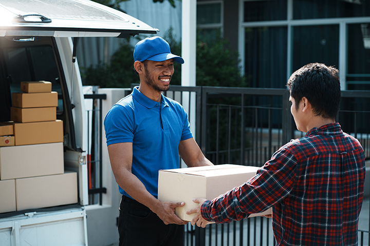 Home 19 delivery man delivering parcel box to customer whi 2025 01 10 05 36 37 utc