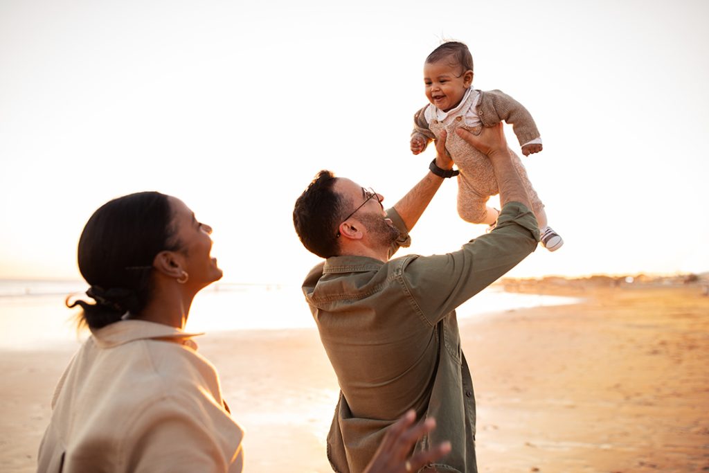 happy parents with little son having fun together 2025 03 18 18 00 18 utc